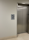 ADA Compliant Elevator Sign – "In Case of Fire Use Stairs," Tactile with Braille – view 3 (SKU ICOF69K)