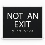 ADA Compliant Not an Exit Sign – 6"x5" Tactile with Braille — Black studio product view; SKU NAE65K.
