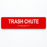 ADA Compliant Trash Chute Sign – 10"x2" Acrylic Braille — Red studio product view; SKU TRC-1002-RED.